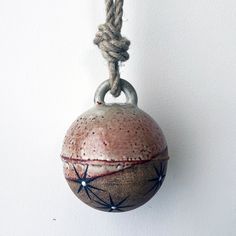 a ball hanging from a rope on the wall