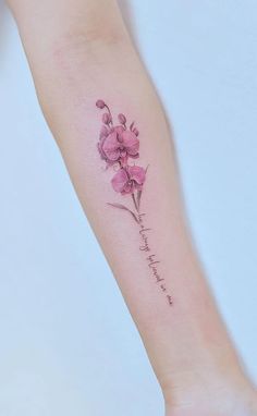 a small pink flower on the left arm