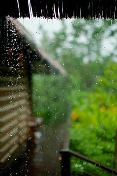 rain is falling down on the outside of a house