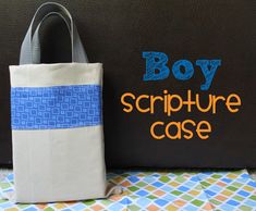 a bag sitting next to a book with the words boy scripture case on it