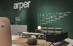 a room with green walls and furniture on the floor next to a sign that says aper