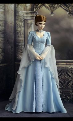 the doll is wearing a blue gown and veil