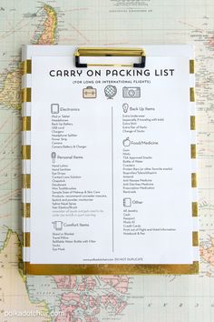 an image of a map with the words carry on packing list written in gold and white