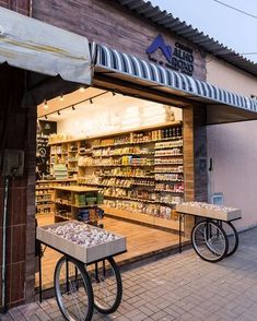 a store front with two bikes parked outside