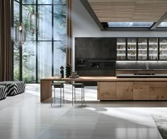 a modern kitchen with zebra print rugs and large windows