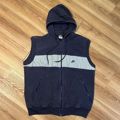 Vintage 1980s Nike Hooded Sleeveless Vest. Thick knit cotton blend. No holes. A few small light stains. Tagged size large. Measurements Pit to Pit: 23" Length: 26" We ship Monday through Friday. If there is a problem with the item, just contact us and we will resolve it. We examine the items carefully but sometimes make mistakes. We have been selling vintage clothing on different online platforms since 2003. Hoodie Vest, Nike Vintage, Vests Mens, Small Light, Sleeveless Vest, Knit Cotton, Zip Up Hoodie, Hoodie Jacket, Zip Hoodie