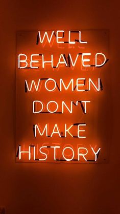 a neon sign that says well behaved women don't make history