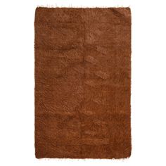 a brown rug with fringes on it