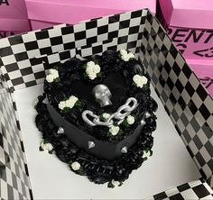 there is a black and white cake in the box