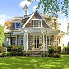 a large house with white trim and windows