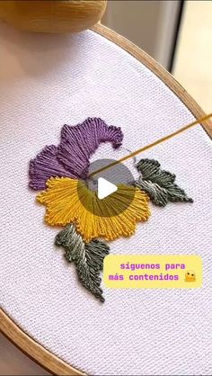 a video demonstrating how to make an embroidered flower