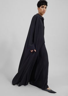 Color: Black Lightweight woven fabric Oversized wide leg silhouette Shirt neckline  Maxi length Side slip pockets Unlined 94% Rayon 6% Polyester Dry Clean By The Frankie Shop Oversized Jumpsuit, The Frankie Shop, Frankie Shop, Black Jumpsuit, Gatsby, Jumpsuits For Women, Woven Fabric, Wide Leg, Jumpsuit