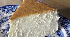 a piece of cheesecake on a blue and white plate