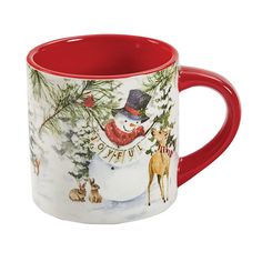 a red and white coffee mug with a snowman on the front, surrounded by animals