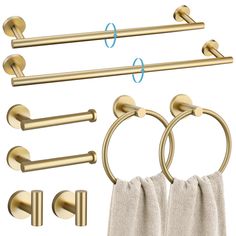 brass bathroom accessories including towel rings and towels