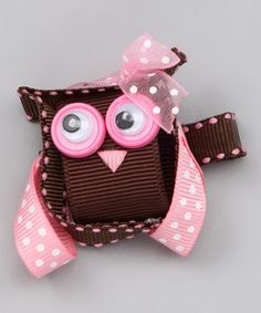 a pink and brown owl brooch with polka dots