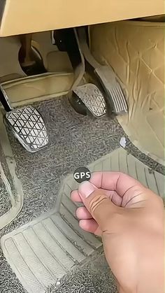 someone is pressing the button on their car's floor mat to check it out