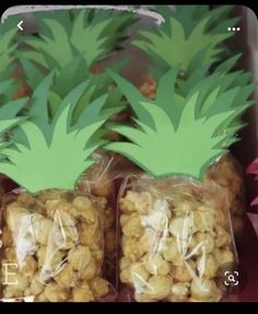 some pineapples are wrapped in plastic bags