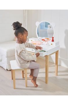 This dressing table and stool, perfect for any little boy or girl, has five drawers offering plenty of storage for little treasures. A generous large round mirror is inspired by forest friends. Ages 3 and up 23.62" x 16.14" x 37.8" table; 13.39" x 9.8" x 13.31" chair 30.91 lb. Rubber wood Spot clean Imported Forest Furniture, Large Round Mirror, Playroom Furniture, Beautiful Forest, Play Space, Play Tent, Forest Friends, E Learning, Dressing Table With Stool