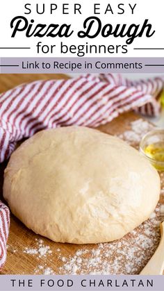 a pizza dough on a wooden board with the title super easy pizza dough for beginners link to recipe in comments