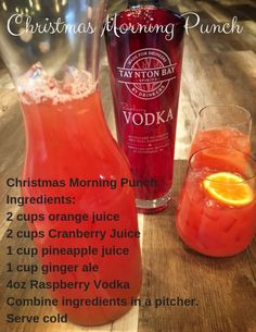 an image of a bottle of christmas morning punch next to a glass filled with orange juice