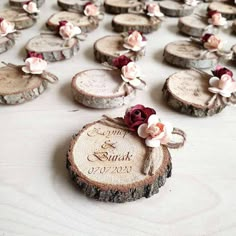 wooden slices with flowers are arranged on the table