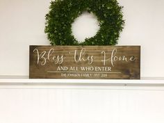 a wooden sign that says, bless this home and all who enter the garden family estr