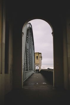 an arch in the side of a bridge