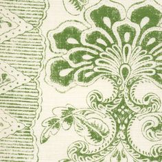 green and white fabric with an intricate design