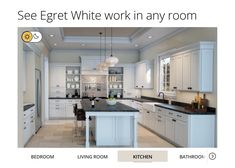 an image of a kitchen with white cabinets and black counter tops on the website page