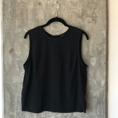 Nwt Banana Republic Factory Black, Sleeveless, Crewneck Blouse With Back Zipper. Side Panels And Thick Bottom Hem. Is A Bit Shorter Than A Normal Shirt And Would Be Cute With Either A Pencil Skirt Or High-Waist Bottoms. Measurements Upon Request. Black Sleeveless Tank Top For Night Out, Casual Black Blouse With Vest Detail, Black Sleeveless Vest Top, Casual Black Blouse With Vest, Casual Workwear Camisole Tank Top, Black Tank Blouse With Vest Detail, Casual Camisole Tank Top For Workwear, Black Vest Tank Blouse, Casual Sleeveless Camisole For Work