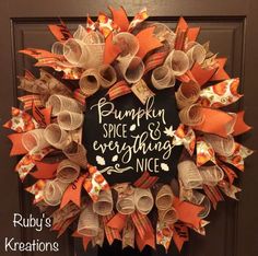 a pumpkin spice and everything nice wreath on a door