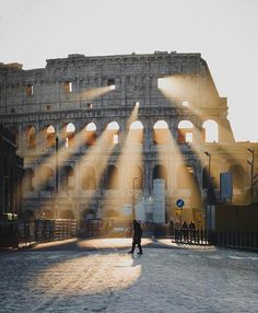 the sun shines brightly on an ancient building