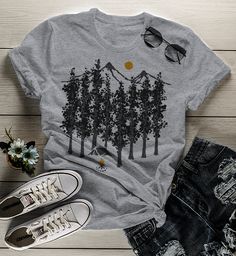 Women's Camping T Shirt Hipster Shirts Forest Nature Shirt Woods TShirt Camping Tee Hipster TShirt For me, there is something so peaceful about camping, especially some place remote where you're truly alone to reflect. This hipster tshirt features a forest scene with a lone tent and campfire. Perfect for your next adventure. If you're going out into the wild for some time to reflect on your own, these hipster shirts are perfect for you! Made of soft ring spun cotton and includes a cotton muslin Casual Gray T-shirt For Outdoor, Gray Short Sleeve Top For Outdoor, Gray Short Sleeve Top For Outdoor Activities, Summer Outdoor Cotton T-shirt, Gray Crew Neck T-shirt For Outdoor Activities, Summer Camping T-shirt With Crew Neck, Gray Crew Neck Top For Outdoor Activities, Gray Summer Outdoor Top, Gray Crew Neck Top For Outdoor