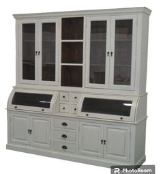 a white china cabinet with glass doors and drawers on the bottom, side by side