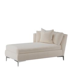 a white chaise lounger with pillows on it's back and side ends