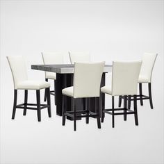 a dining table and chairs with white upholstered backrests on each side