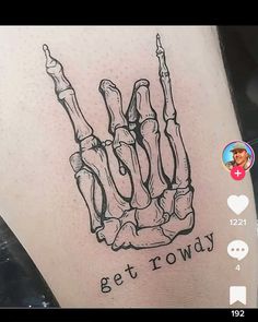 a tattoo that reads get rowdy on the back of a leg with a skeleton hand