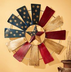 Stars and Stripes Windmill | Wild Wings. Ceiling Fan Crafts, Fan Blade Art, Ceiling Fan Art, Windmill Diy, Ceiling Fan Parts, Americana Crafts, Windmill Decor, Recycled Metal Art, 4th July Crafts