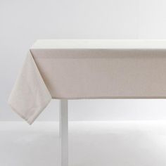 an empty table with a white cloth on it