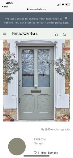 the front door is painted gray and has two windows