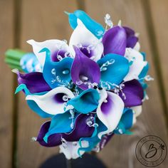 a bridal bouquet with purple and white flowers