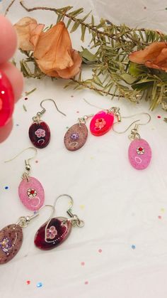 These oval shaped resin dangling earrings are lightweight. Just so cute for spring and summer or anytime wear. Hypoallergenic ear wires for sensitive skin. They are at my shop come and check the out and there is more to see.#resin #resinearrings #oval #floral #jewelry #earrings #multicolor #dangle #dangleearrings #dangledropearrings #handmade #handmadewithlove #handmadejewellery #handmadeearrings #unique #uniquejewelry #uniquegift #gift #giftsforher #giftsformom #etsy #etsyseller #etsyshopowner #etsysmallbusiness Floral Jewelry, Handmade Earrings, Wire Jewelry, Ear Wires