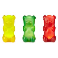 four gummy bears in different colors on a white background