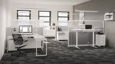 an office with two computer desks and one chair in front of the desk is black and white