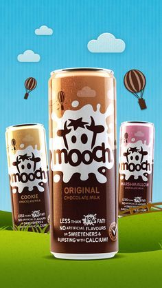 three cans of mooch chocolate milk with hot air balloons in the sky behind them