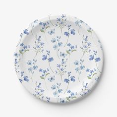 a white plate with blue flowers on it