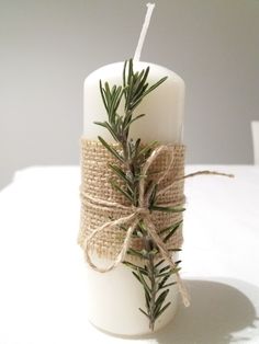 a candle wrapped in twine and tied with jute