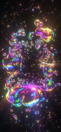 an image of soap bubbles floating in the air with bright colors and sparkles on them