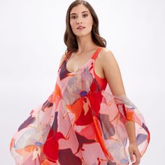 Lively With Its Playful Patterns, This Frank Lyman Dress Is A Stunning Choice. It Features A Plunging Neckline And Exposed Shoulders, All Held Together By A Sheer, Chiffon Cape. Drapey And Elegant, This Stunning Choice Is An Undeniably Appropriate Choice For The Summer Season. 246142 100% Polyester No Pockets No Zipper Our Model Is 5'9"/175 Cm And Wears A Size 6. Approximate Length (Size 12): 41" - 104 Cm Pink Silk A-line Midi Dress, Summer Sleeveless Pink Silk Dress, Pink Sleeveless Silk Summer Dress, Beachwear Silk Dress With Floral Print, Pink Sleeveless Silk Dress For Party, Pink Fitted Sleeveless Silk Dress, Pink Sleeveless Silk Dress For Spring, Pink Silk Feminine Dress, Feminine Pink Silk Dress